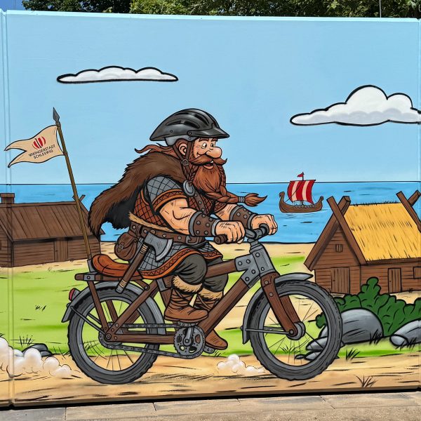 Graffiti Comic Schleswig mit Wikinger Motiv auf einem Beton WC